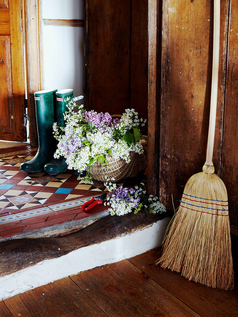 Wellington boots and cut flowers on Devon porch step