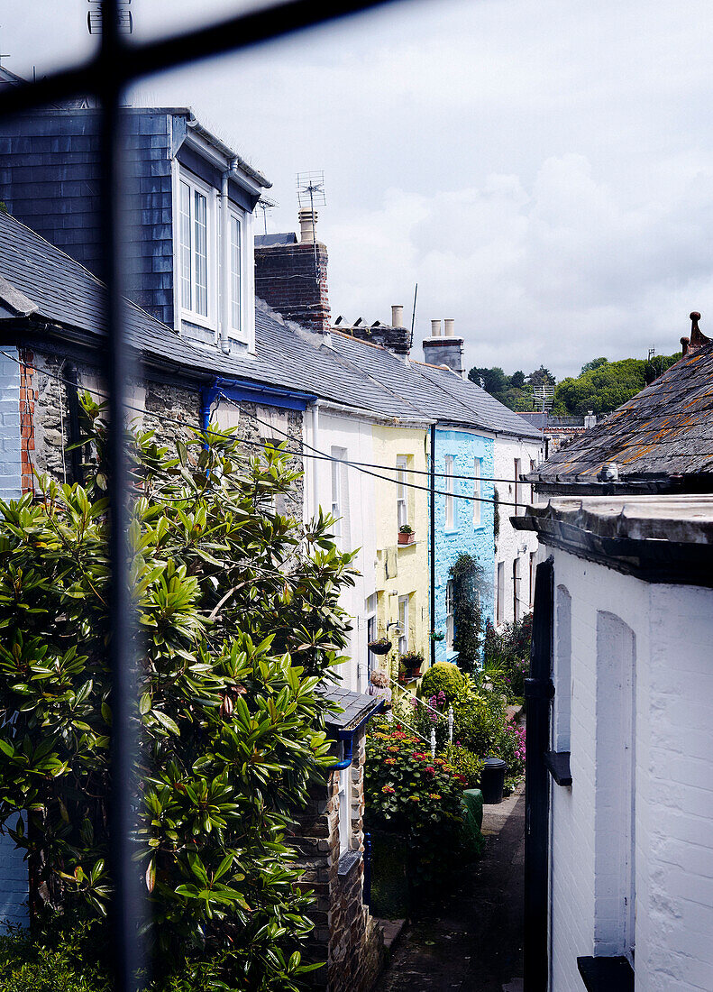 Village rooftops viewed through leaded window