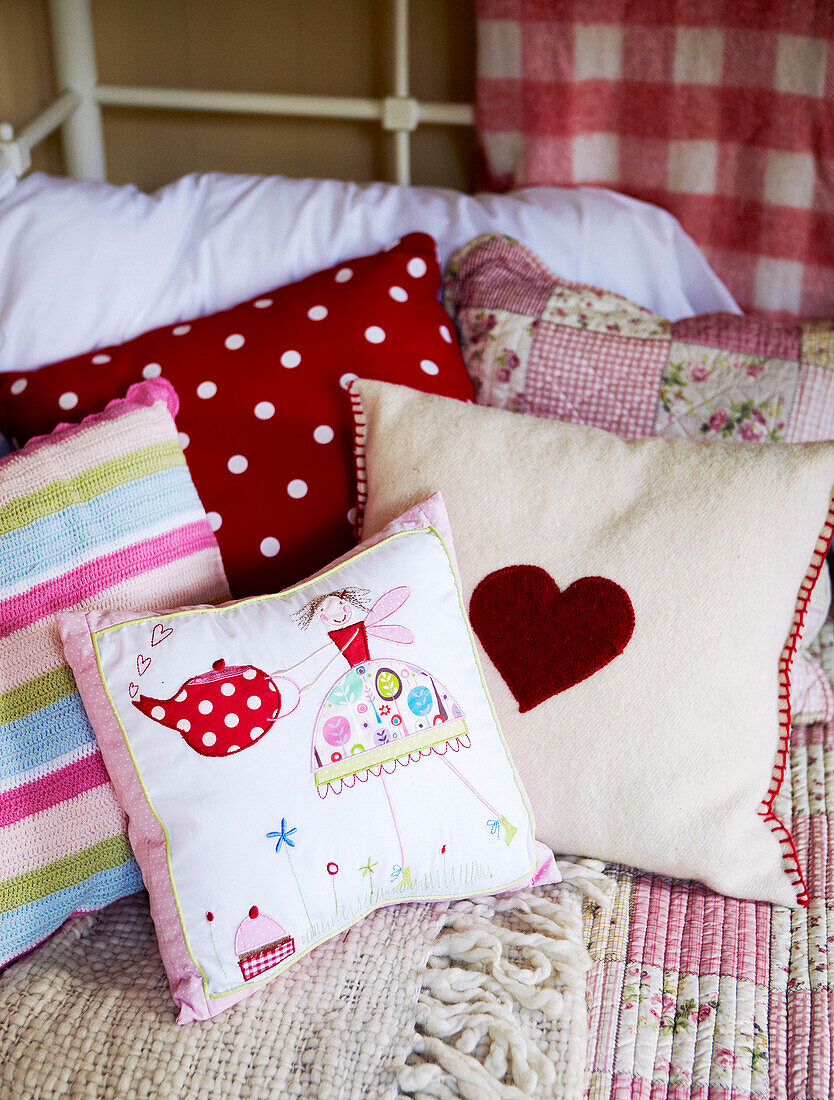 Personalised cushions on daybed