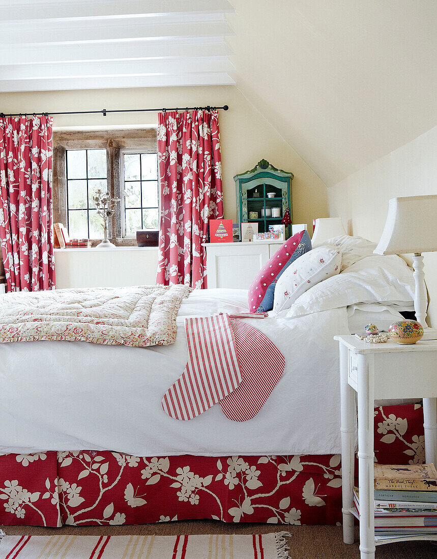 Co-ordinated curtains and bed valence in country house bedroom