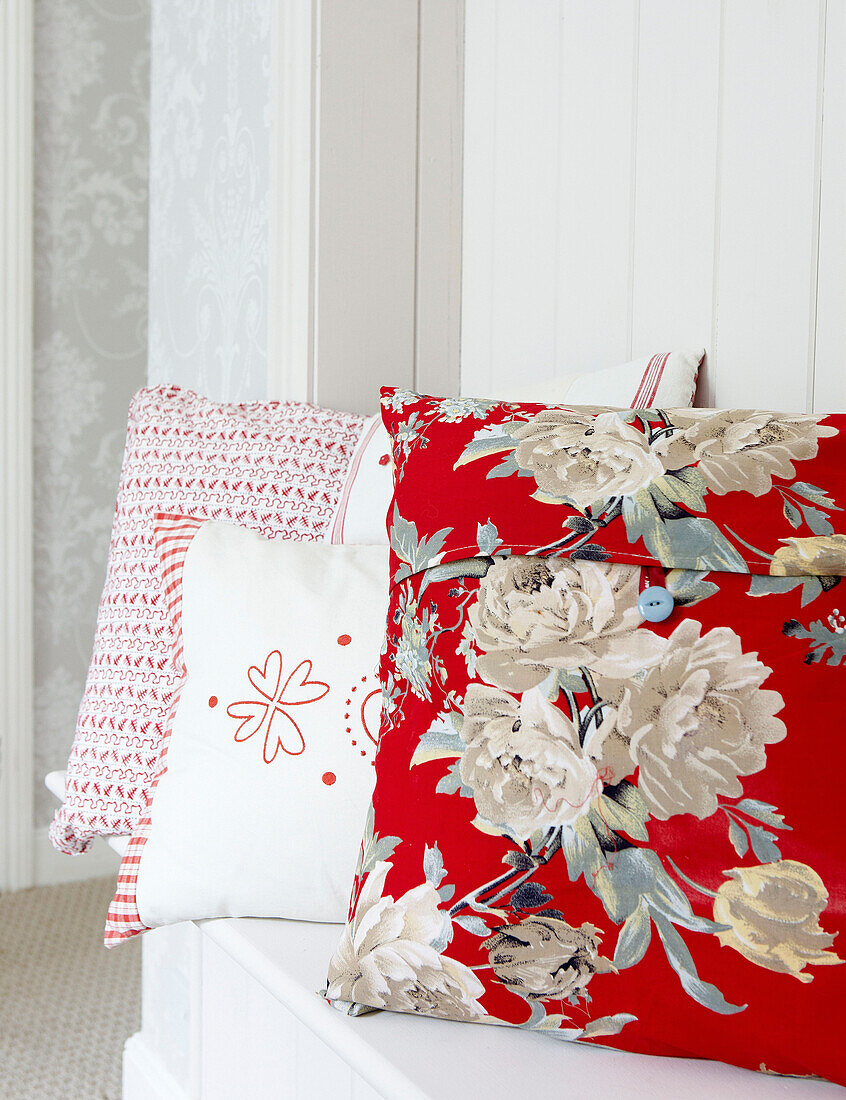 Floral patterned cushion on bench seat in family home