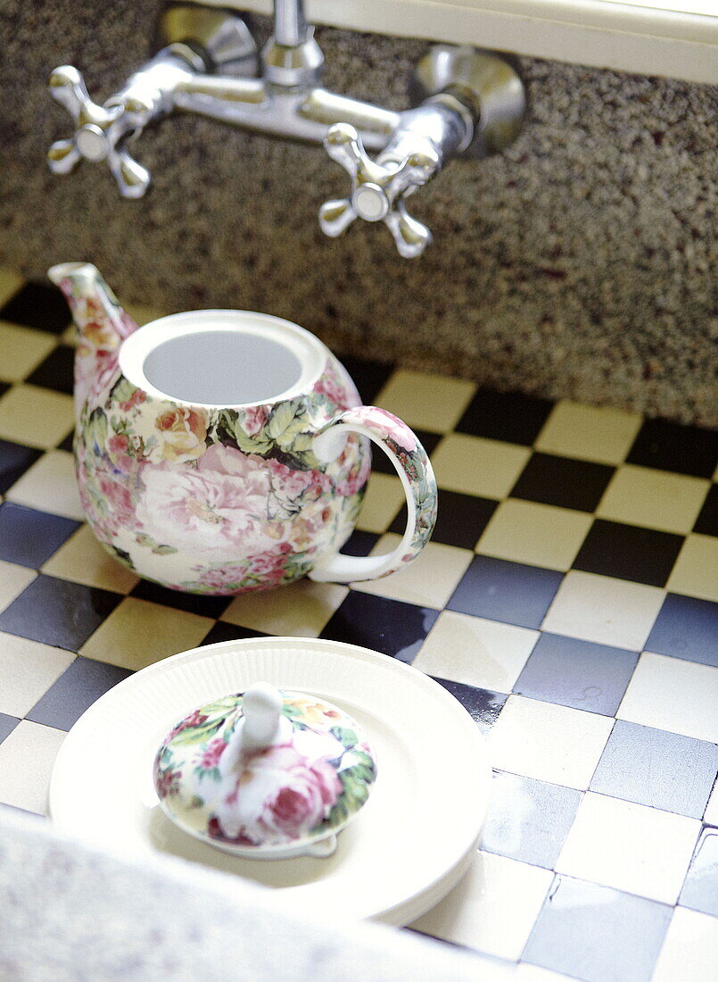 Floral teapot in checked patterned sink Abbekerk Dutch province of North Holland in the municipality of Medemblik