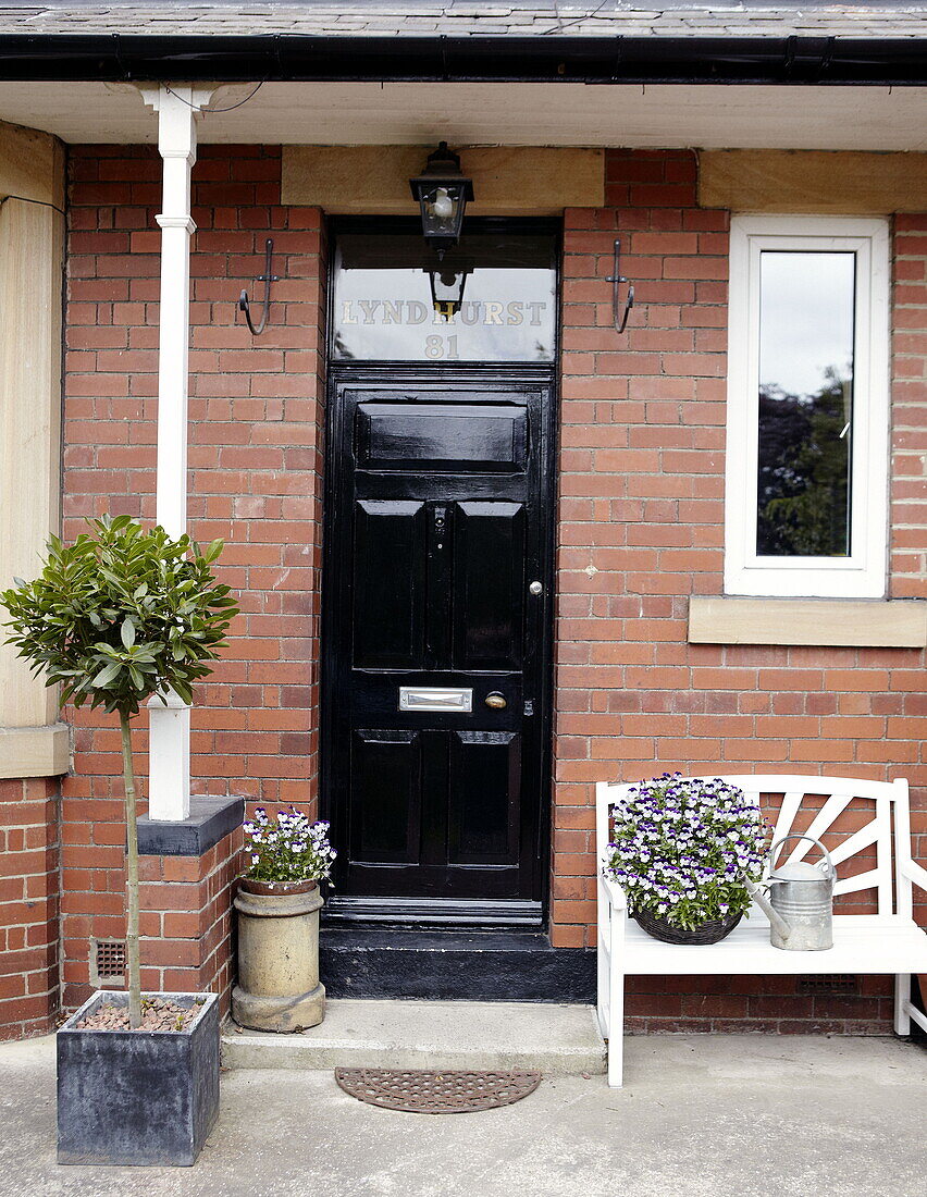 Black front door on brick exterior porch Gateshead Tyne and Wear England UK