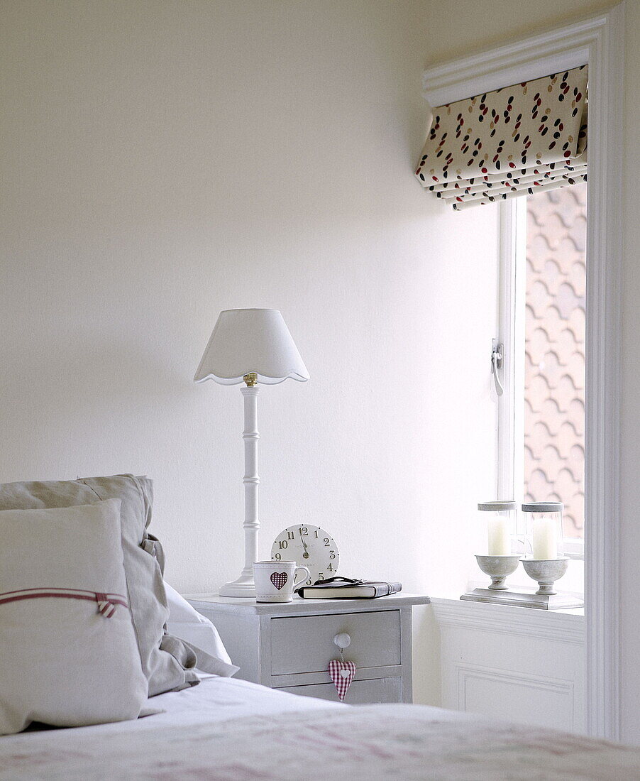 Bedroom detail with roman blinds at window in country house Tunbridge Wells Kent England UK