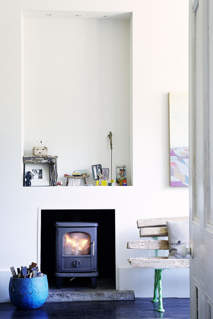Recessed alcove above woodburner in London family home UK