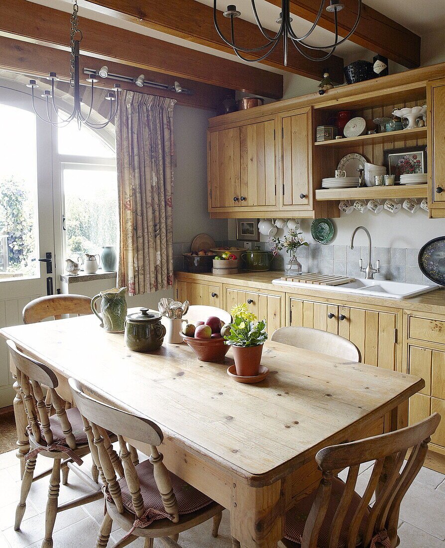 Wooden kitchen table and chairs in Hexham country house Northumberland England UK