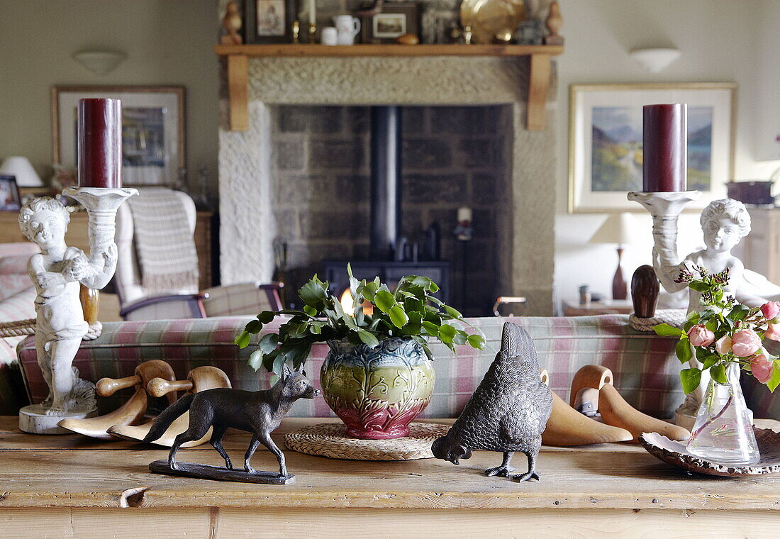 Ornaments and candle holders on console table in Hexham country house Northumberland England UK