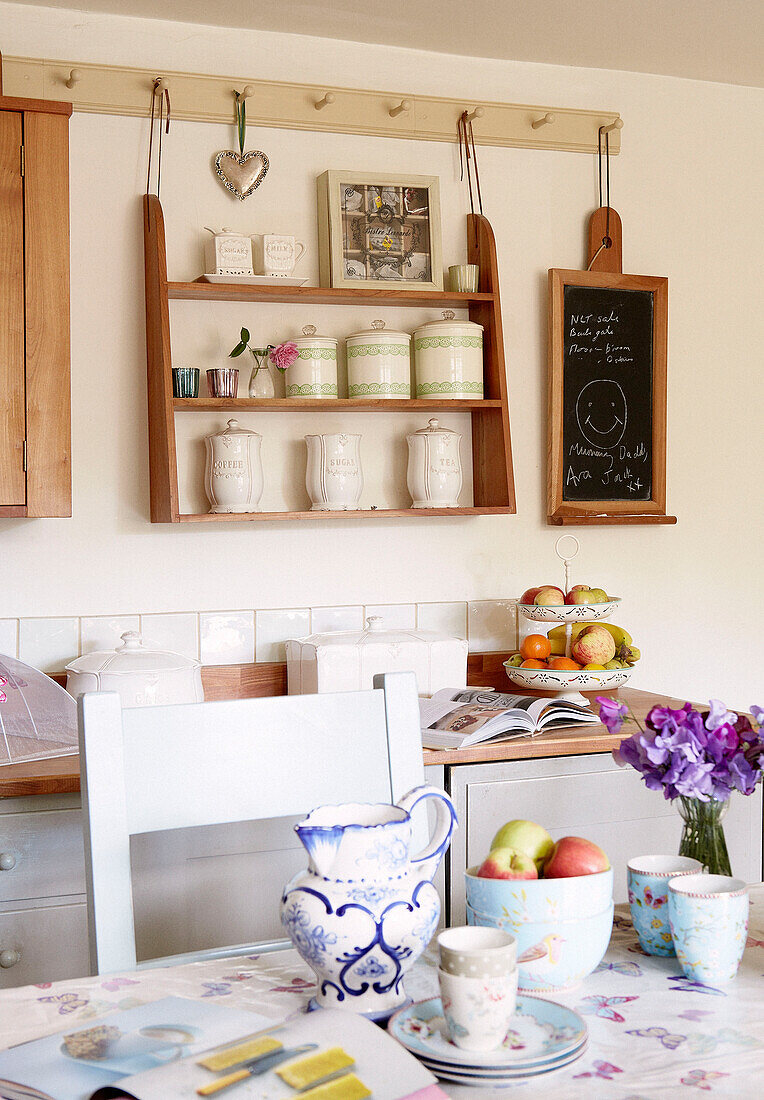 Wall mounted shelf unit in kitchen of Oxfordshire cottage, England, UK