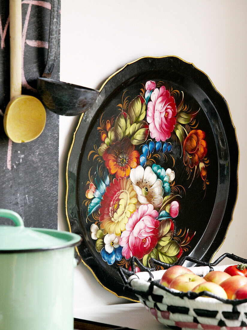 Floral black tray with ladles and fruitbowl in kitchen of contemporary apartment, Amsterdam, Netherlands