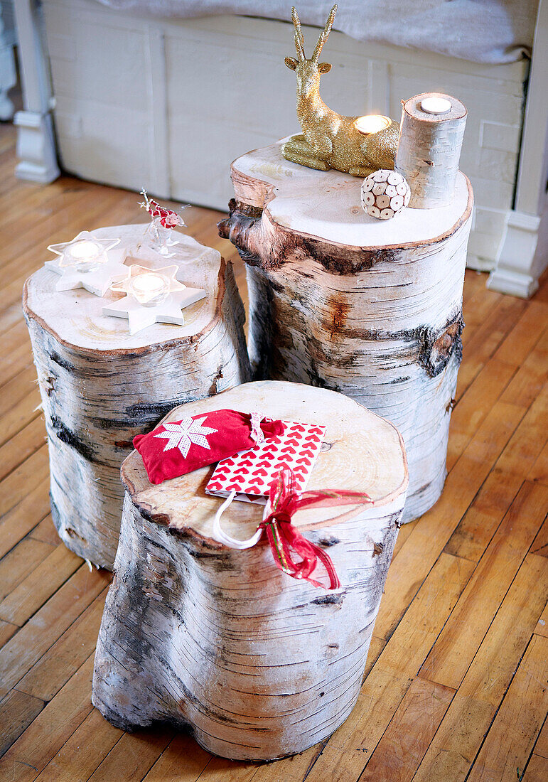 Christmas decorations on hewn logs in Derbyshire farmhouse England UK