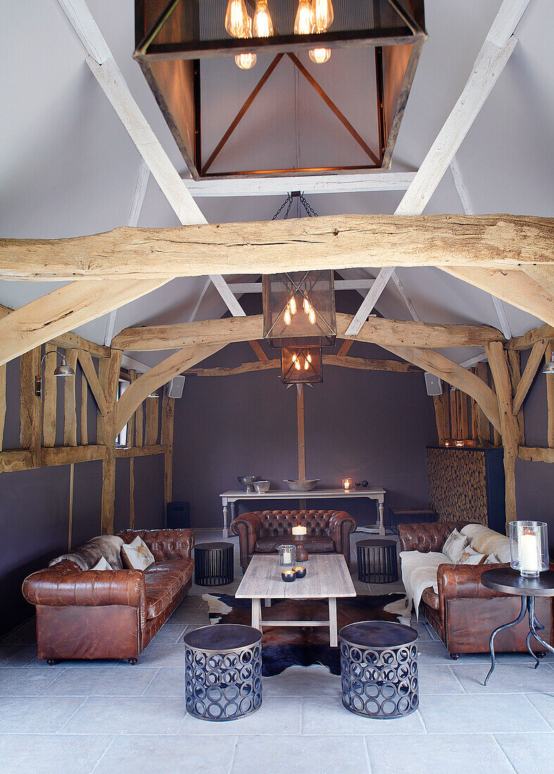Brown leather sofas in living room interior of Buckinghamshire barn conversion UK
