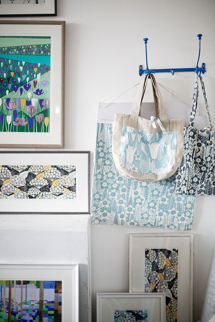 Textile designed handbags with framed artwork in Birmingham work studio England UK
