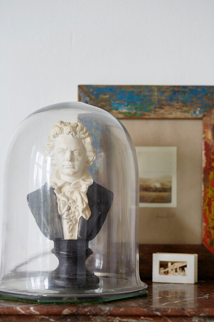 Historic bust under bell jar with framed artwork in Country Durham home, North East England