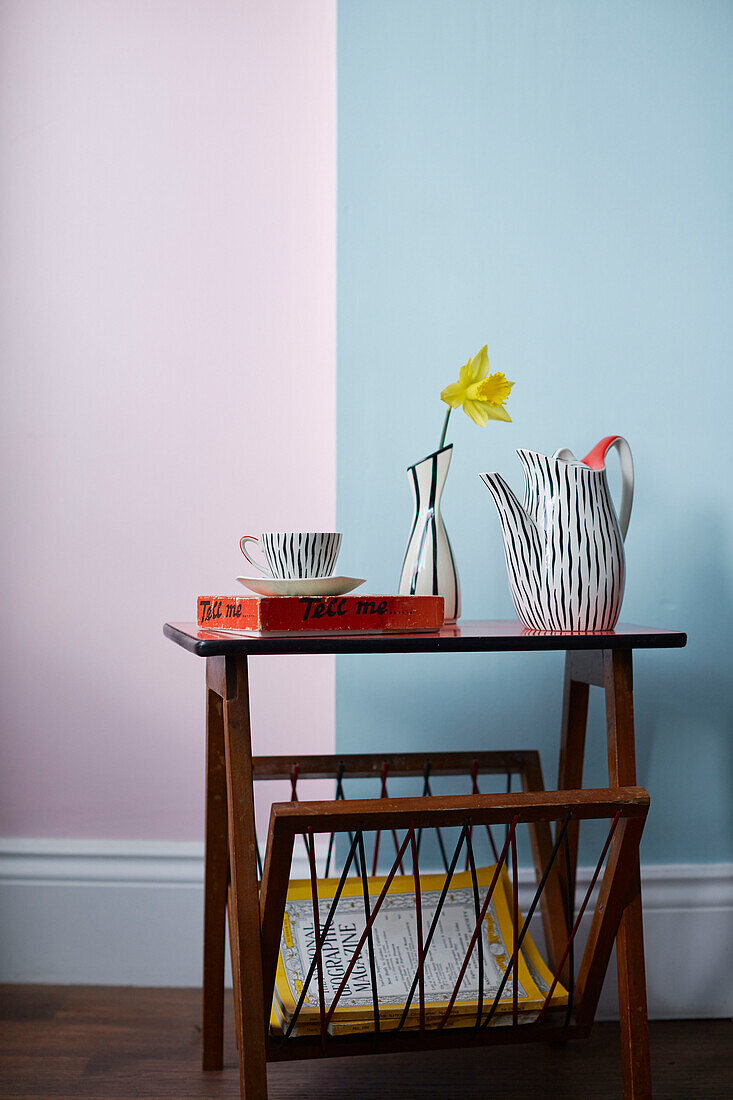 Single stem daffodil with retro crockery in County Durham home, North East England, UK