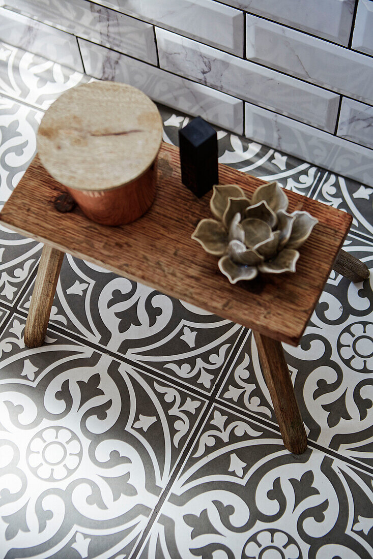 Devonstone floor tiles with ornaments on stool Holmfirth, West Yorkshire, UK