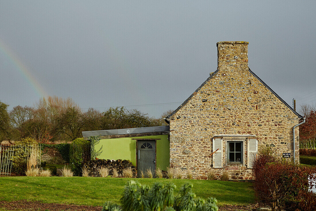 Brittany cottage garden with rainbow France