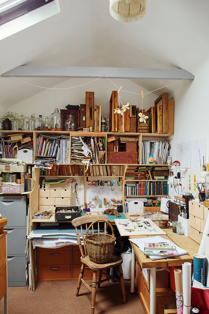 Filing shelves above artist's desk in Gladestry on South Wales borders