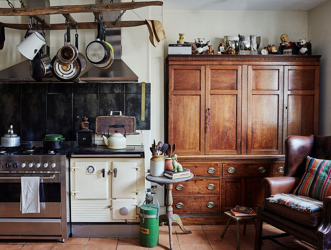 Traditional farmhouse kitchen with pan rack and wooden dresser in Devon, UK