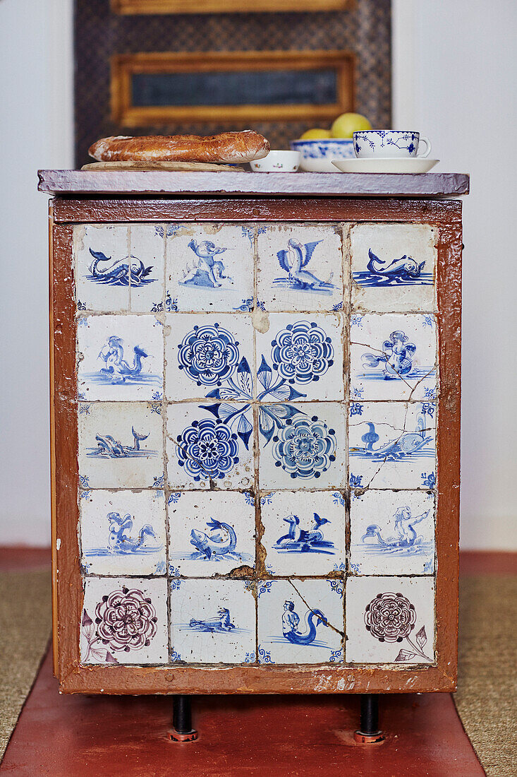 Antique tiles on island unit with baguette in Foix, Ariege, France