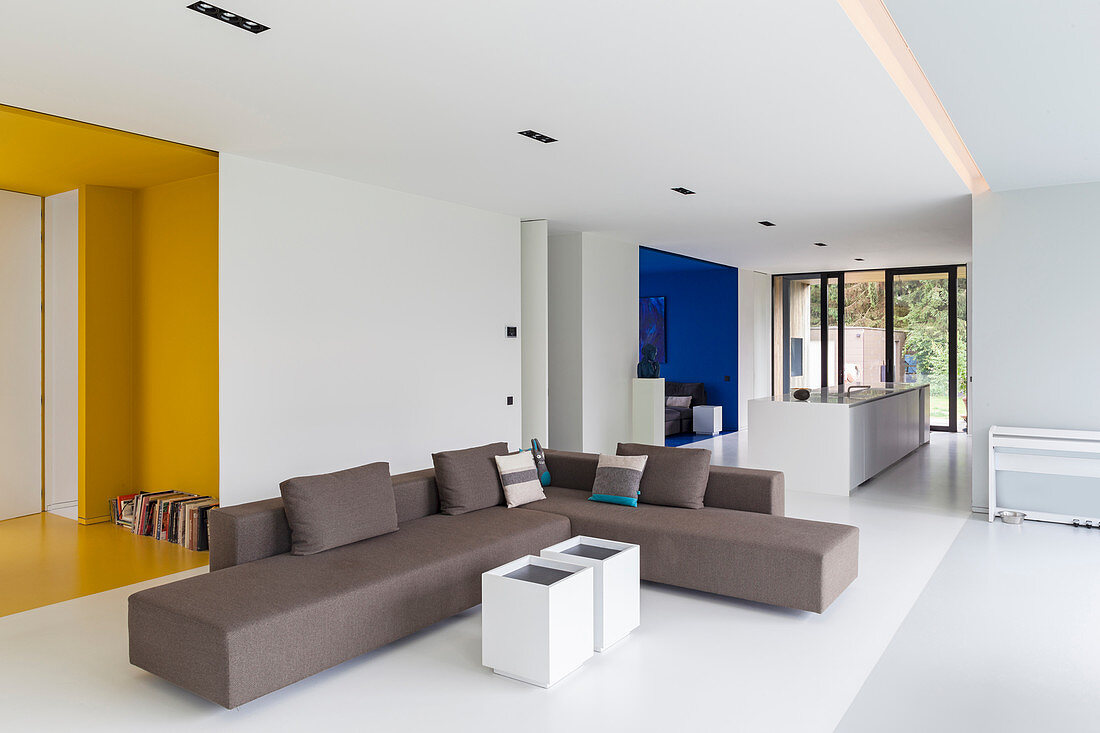 Modern, open-plan interior with brightly coloured alcoves