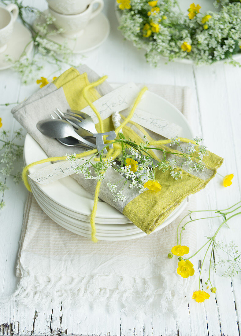 Arrangement of cow parsley and buttercups on plate for 60th birthday