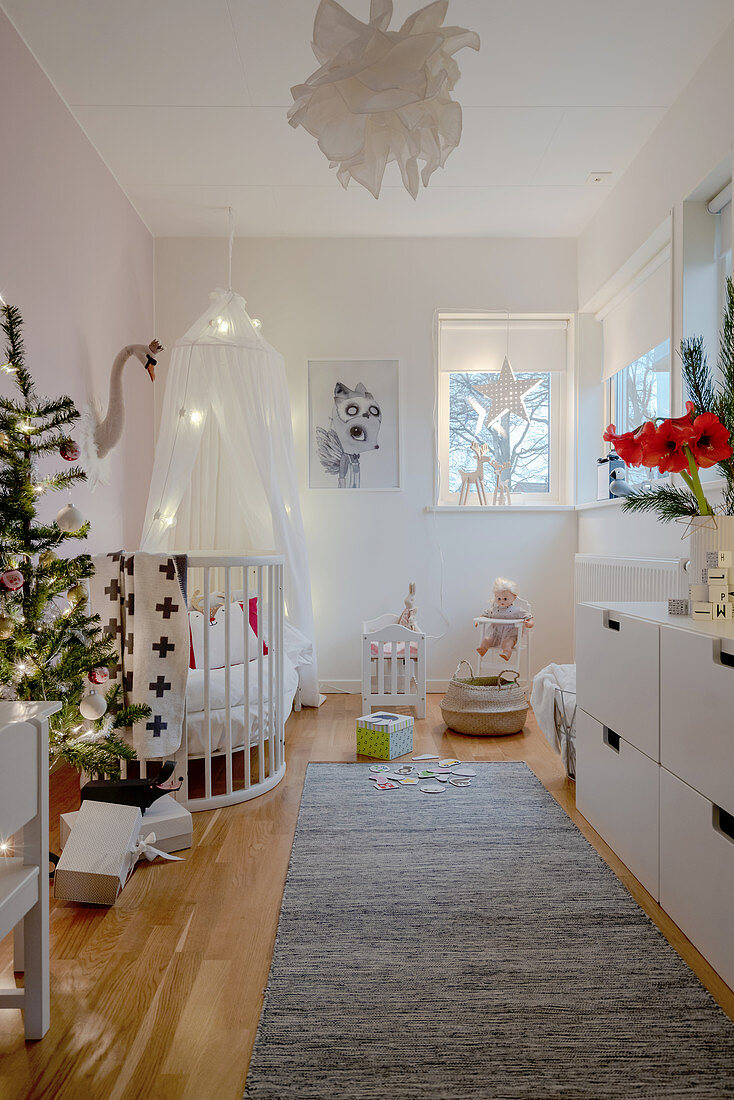White nursery decorated for Christmas