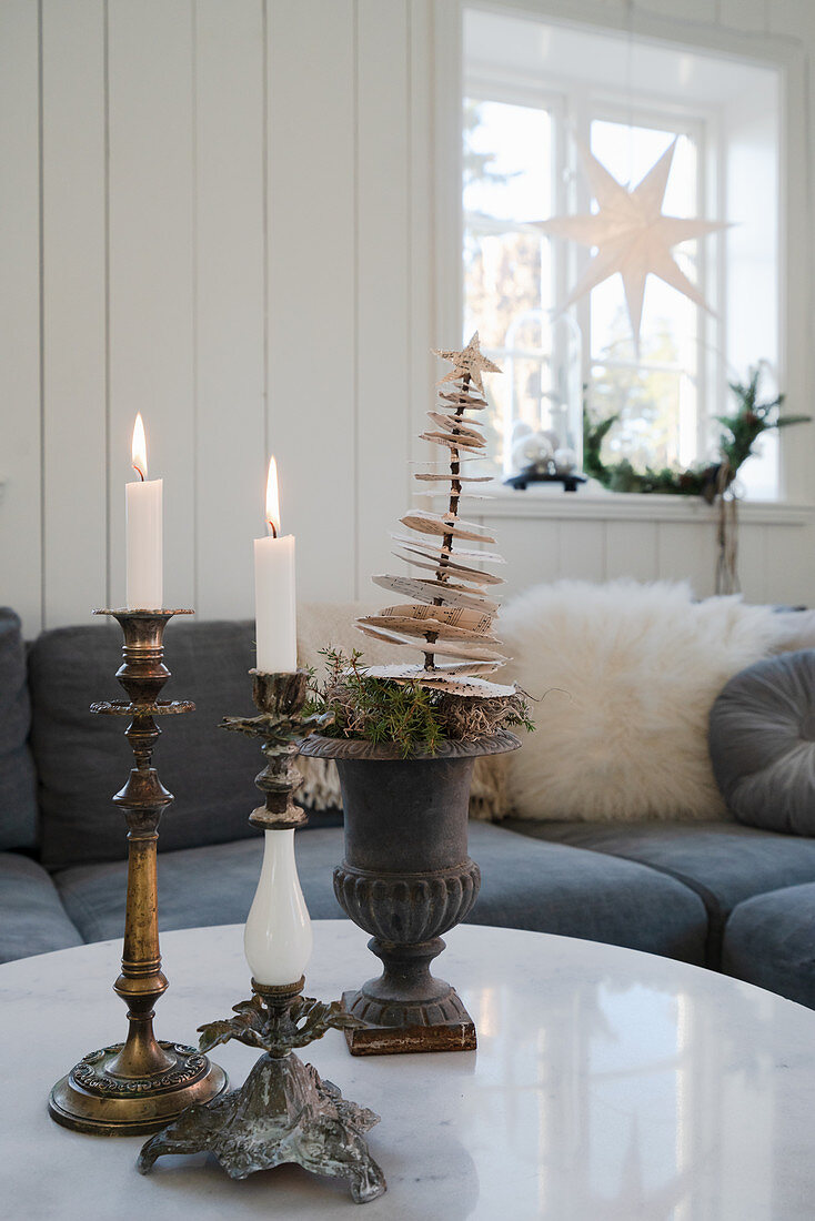 Vintage candlesticks and Christmas decorations on coffee table