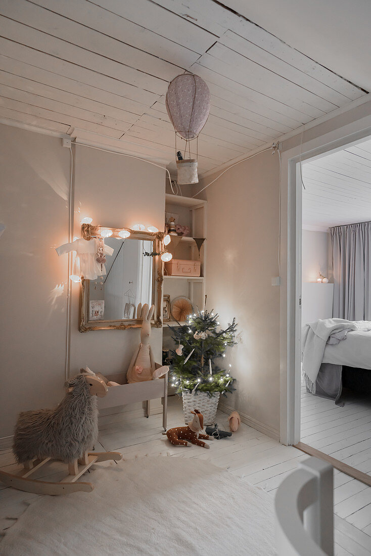 Festive lights in vintage-style nursery decorated in grey