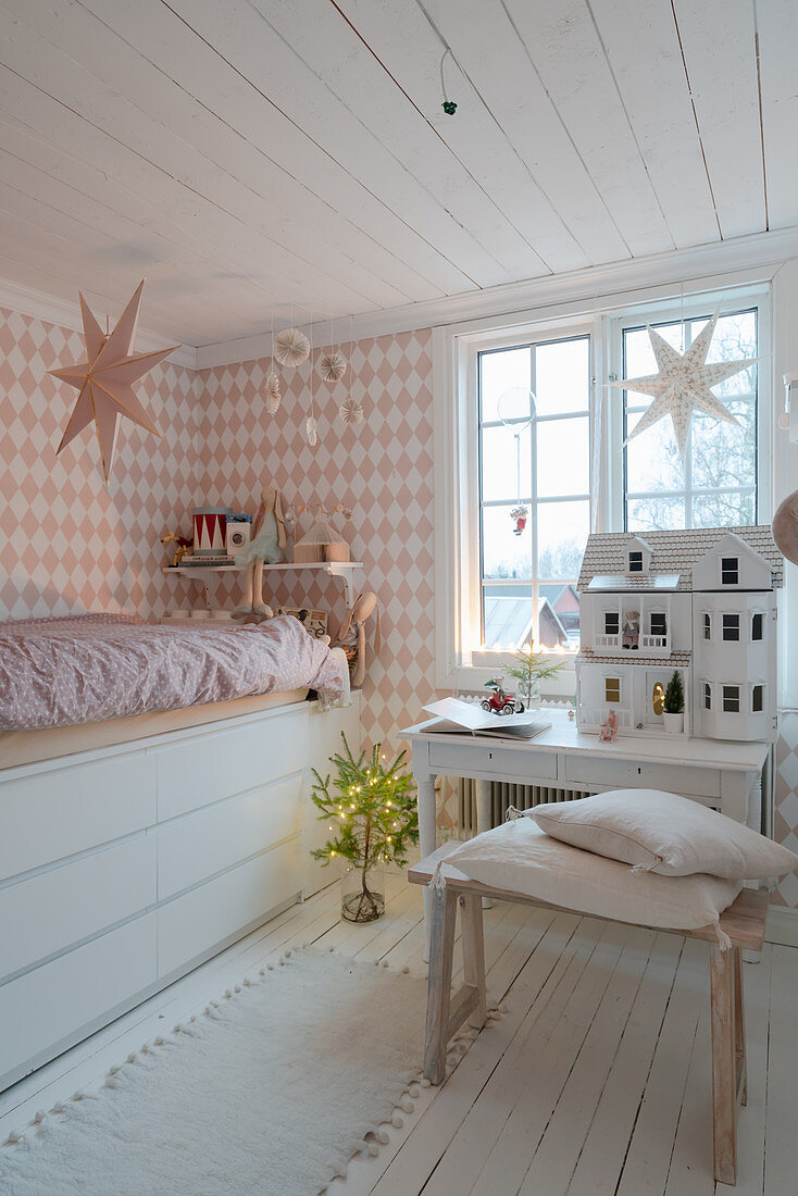 Bed with drawers below in vintage-style child's bedroom