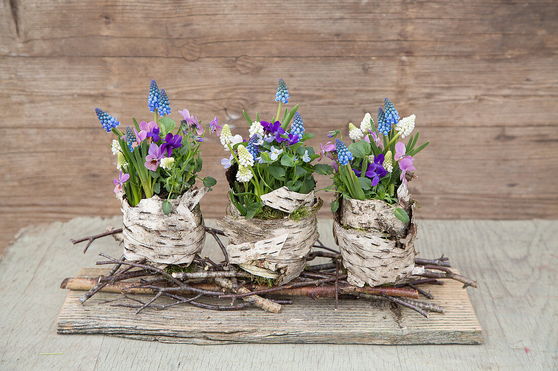 Spring flower arrangement decorated with birch bark