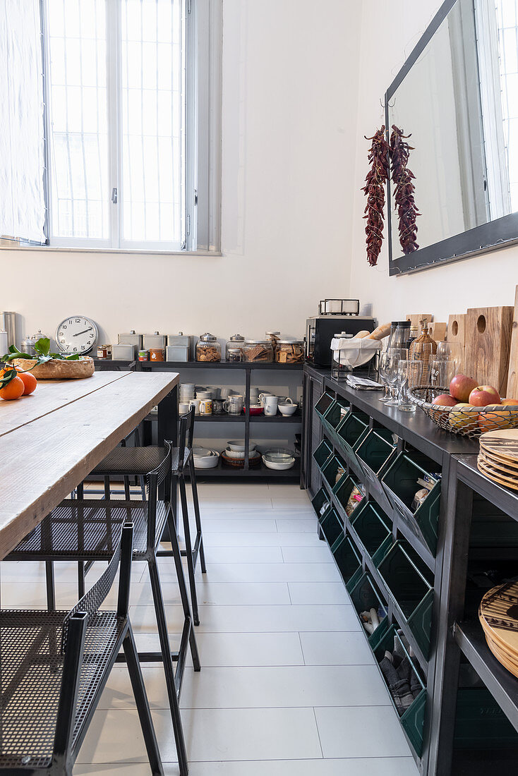 Shelves and angled bins in industrial-style kitchen