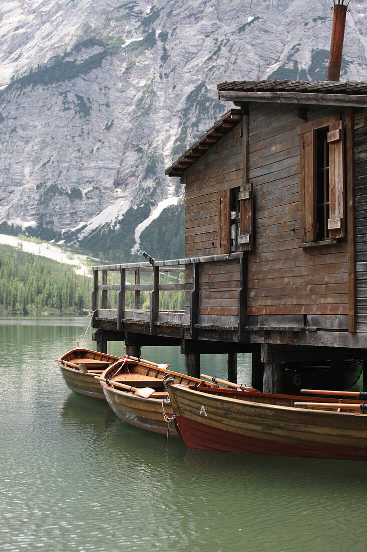 Boathouse and boats on Lake Prags, South Tyrol, Italy
