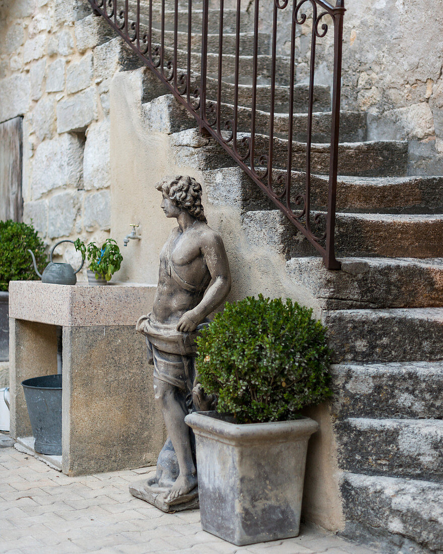 Original 18th-century stone steps and classical statue