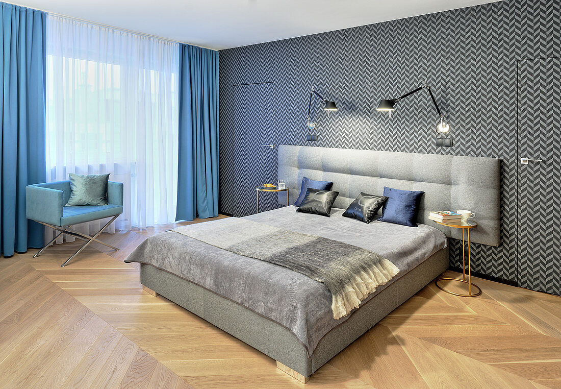 Elegant bedroom in hotel style with graphic pattern on wallpaper
