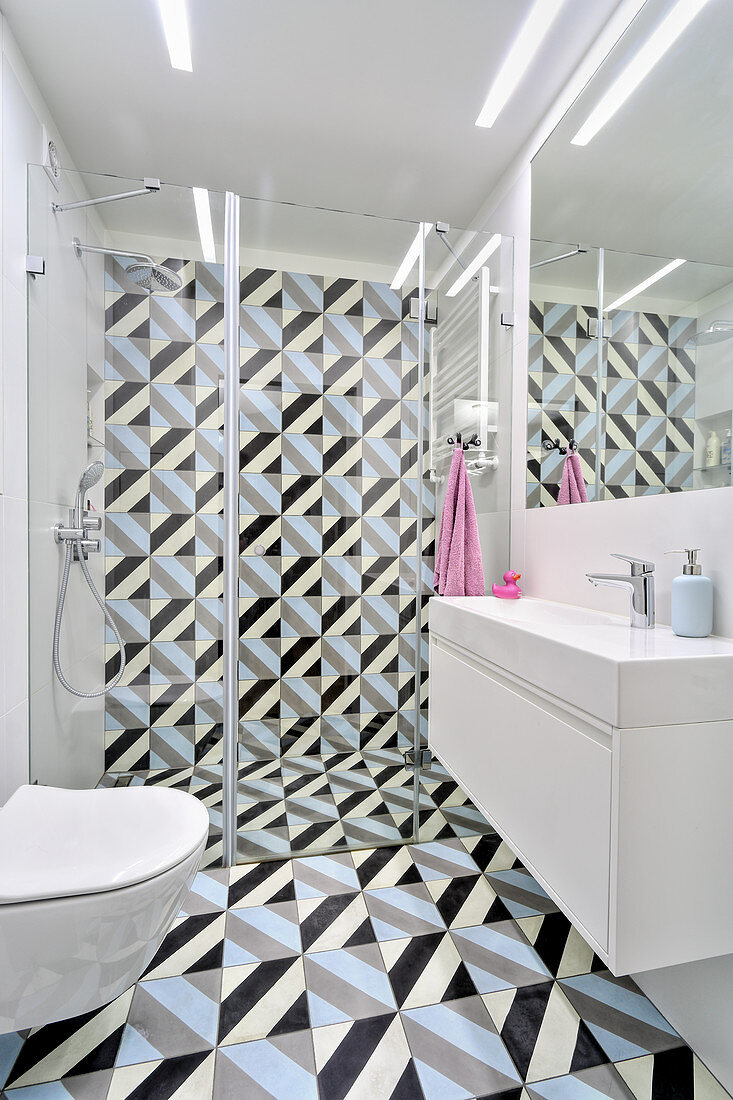 Tiles with graphic pattern on floor and wall of modern bathroom