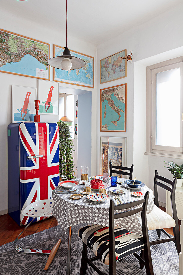 Retro fridge with Union-Flag front and framed maps in dining room