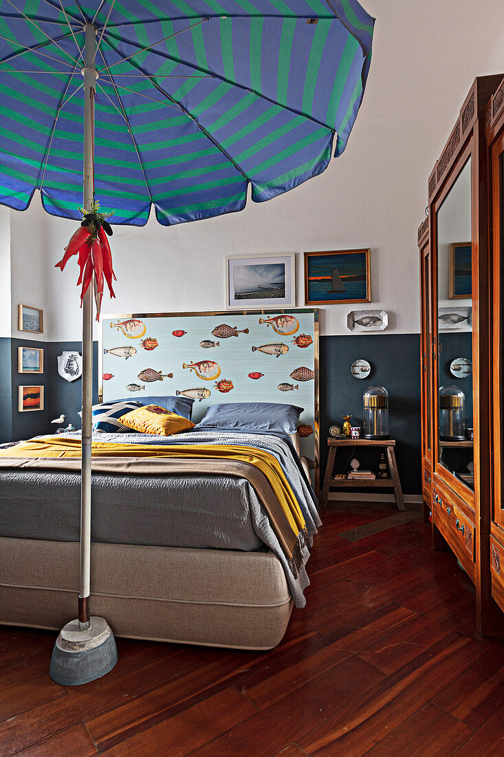 Parasol in classic bedroom with maritime accessories
