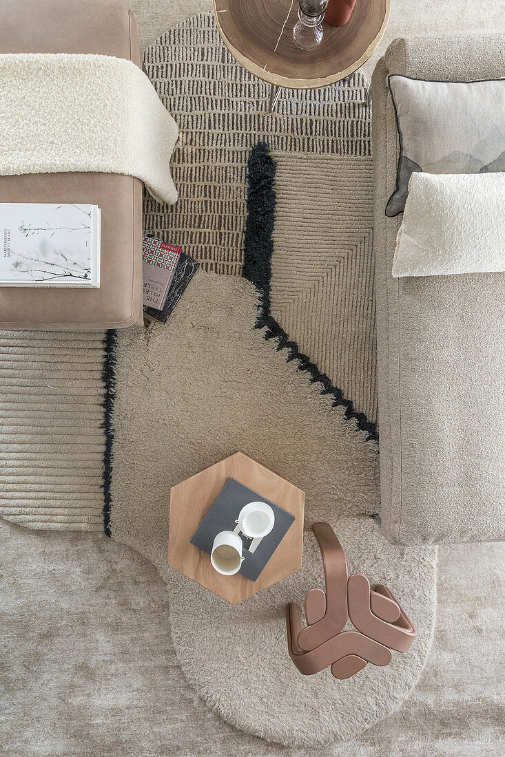 Layers of home textiles in beige living room