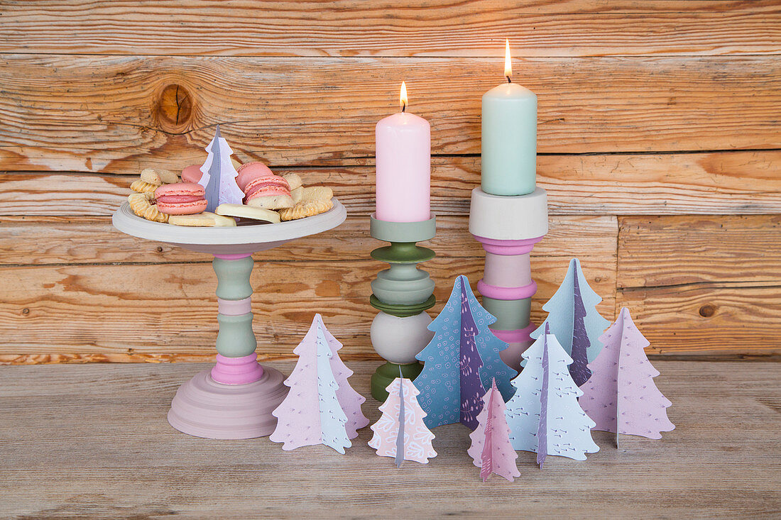 Painted cake stand, candlesticks and paper trees in pastel shades