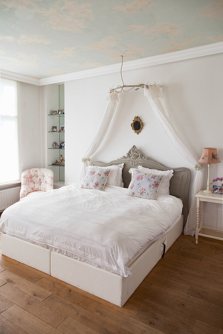 Double bed with bed crown in bedroom