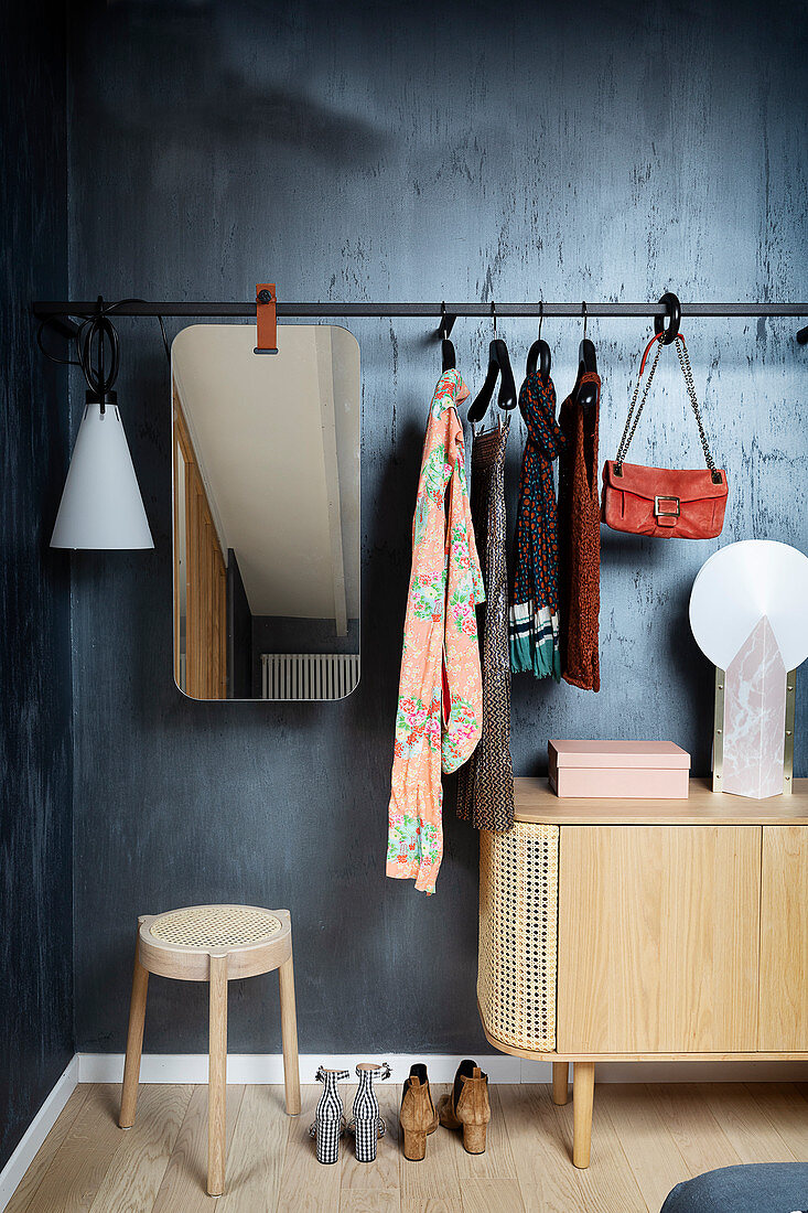 Coat rack with mirror above lowboard