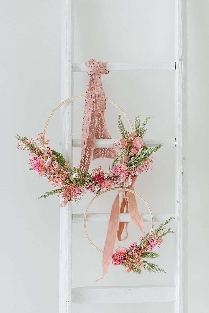 A DIY spring wreath made from wooden hoops and dried flowers