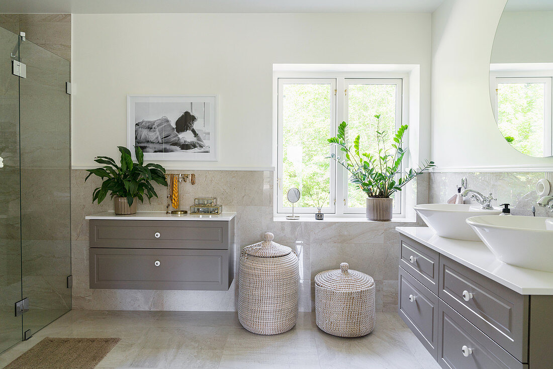 A spacious bathroom in grey tones