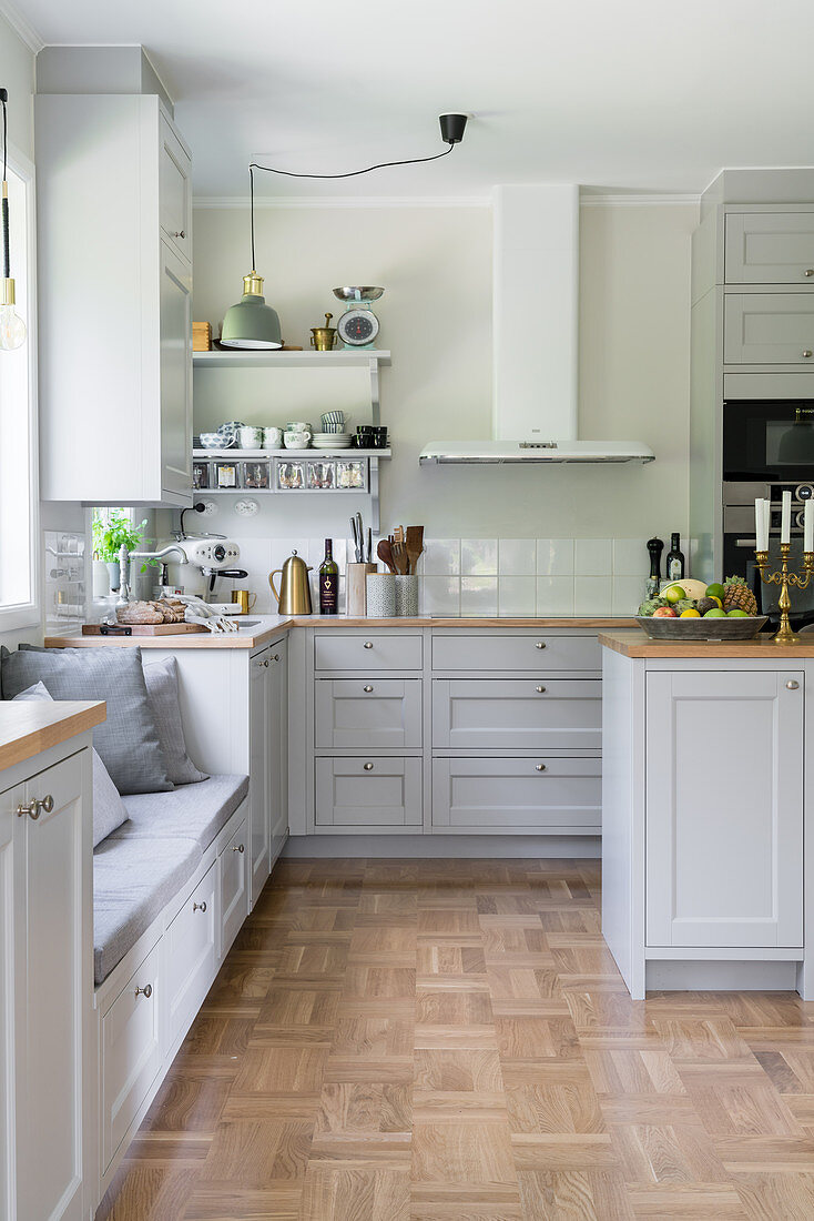A bright, spacious kitchen with grey cabinet fronts