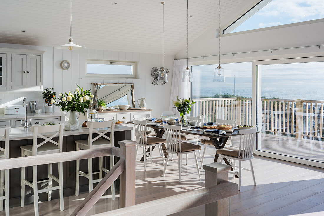 Open plan kitchen and dining room with sea views