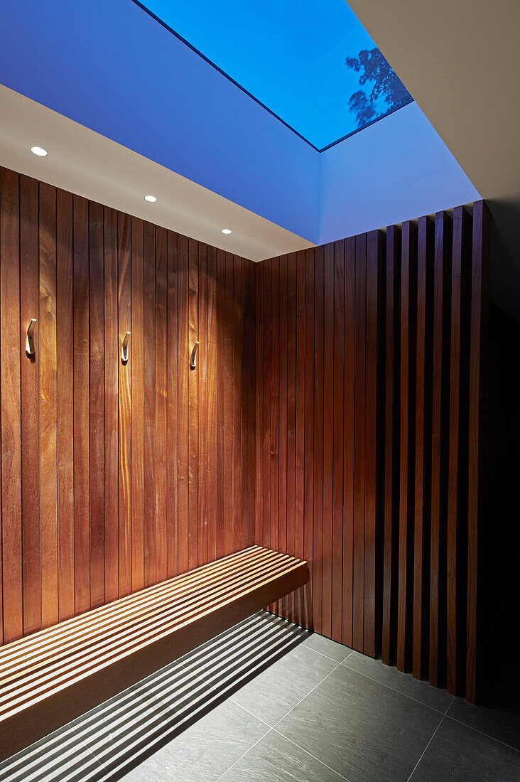 A spa area with wooden panelling and a skylight