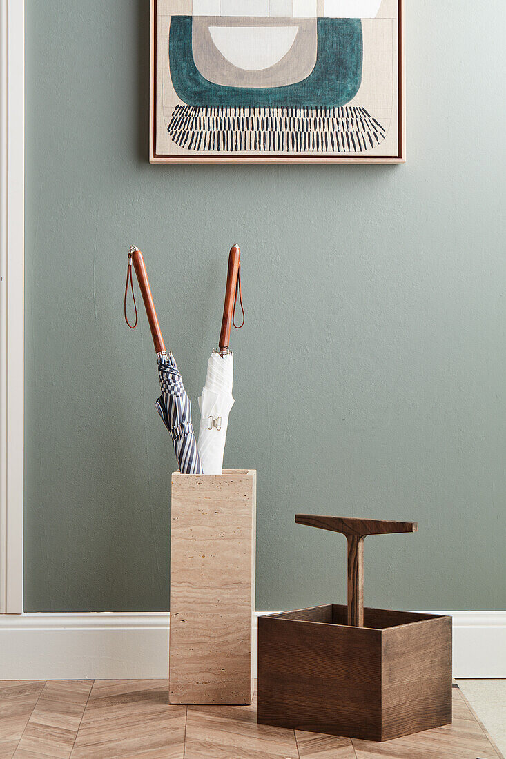 Umbrella stand and wooden toolbox in the hallway