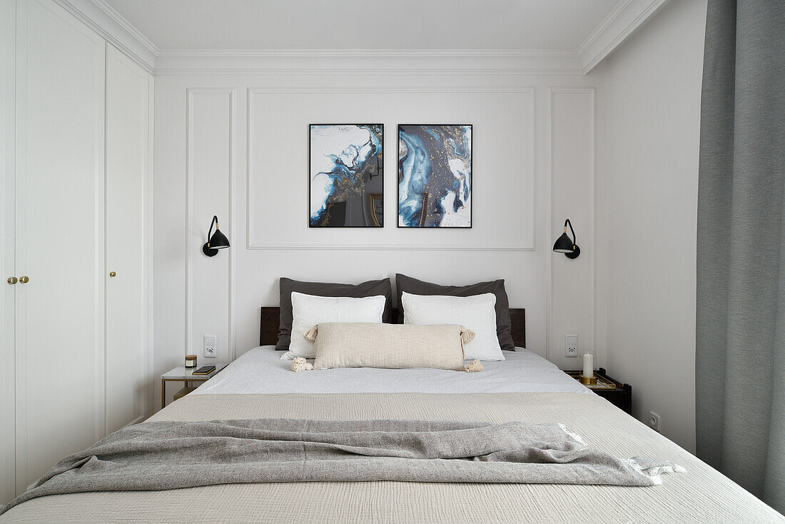 Queen bed and built-in closet in bedroom with elegant stucco work