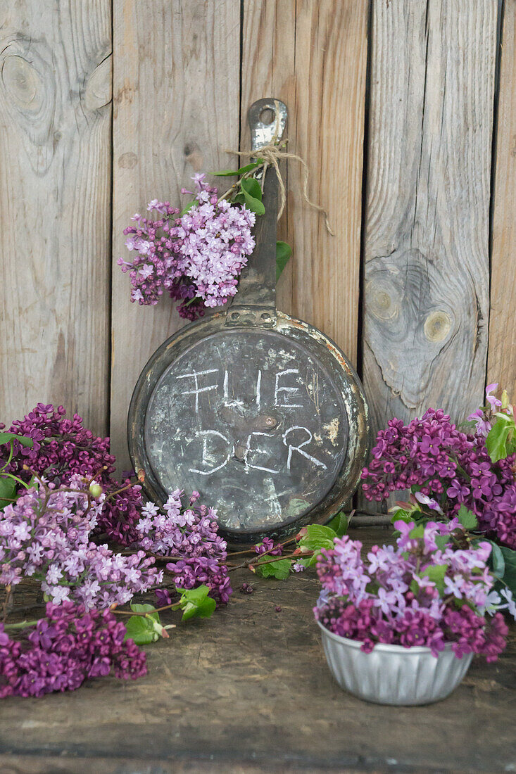 Lilac flowers with nostalgic utensils