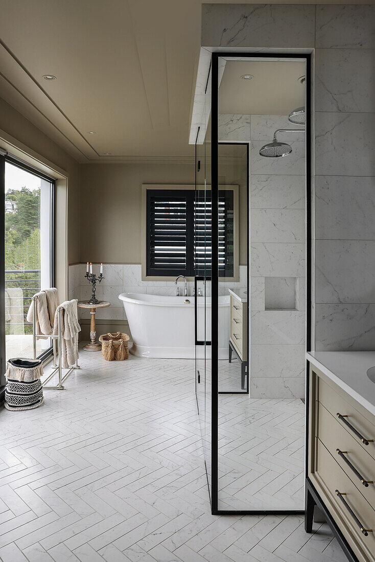 Shower area with mirrors in spacious bathroom
